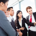 Real estate investors writing on a board