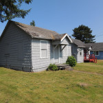 Rundown home in grassy area