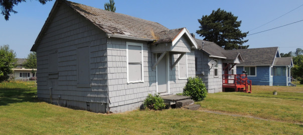 Rundown home in grassy area